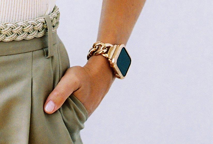 Anne Klein model Maggie Rawlins withhand in pocket wearing new Anne Klein Apple Watch band