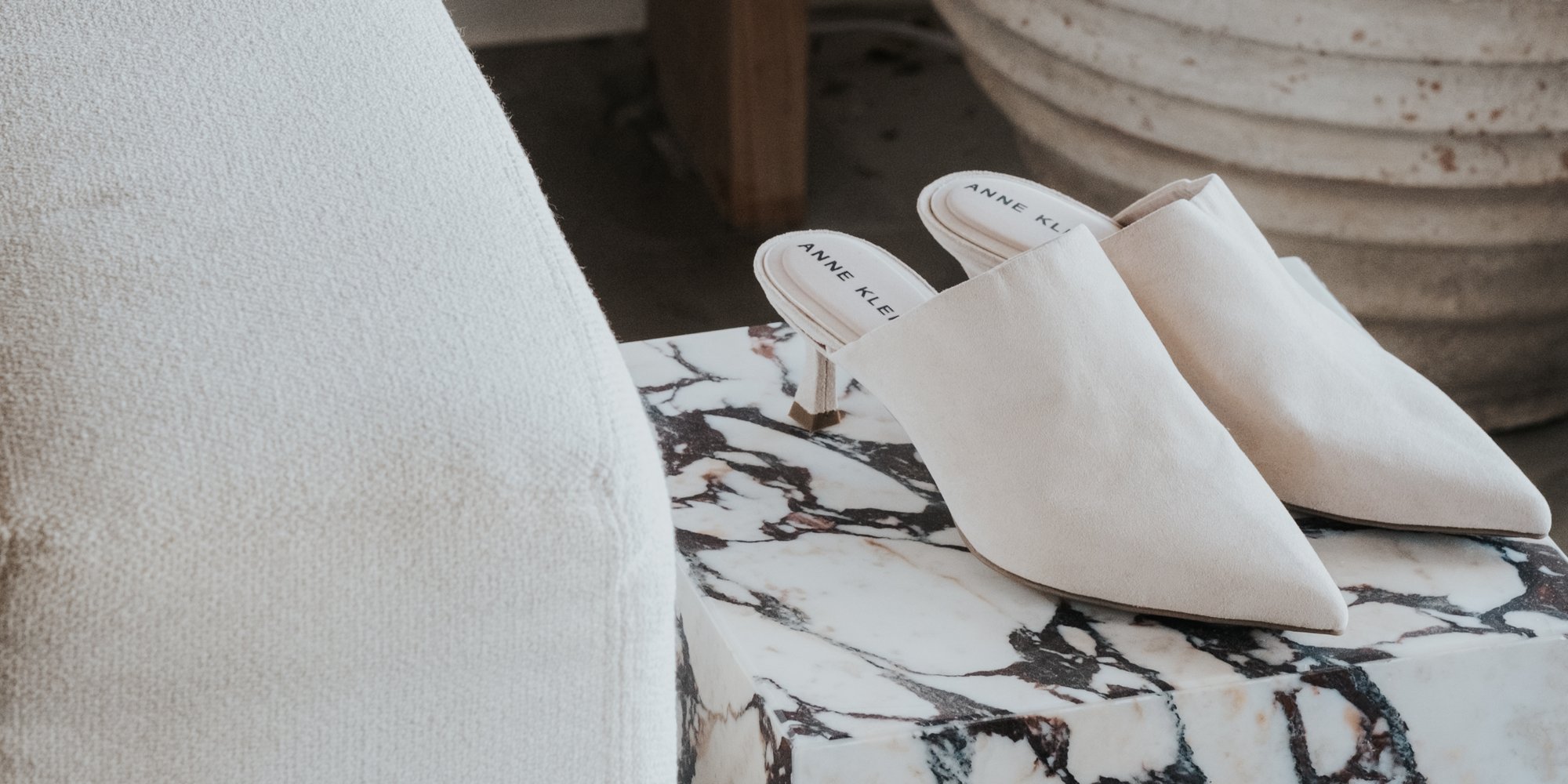 Anne Klein Impress Oat Mules on marble stand